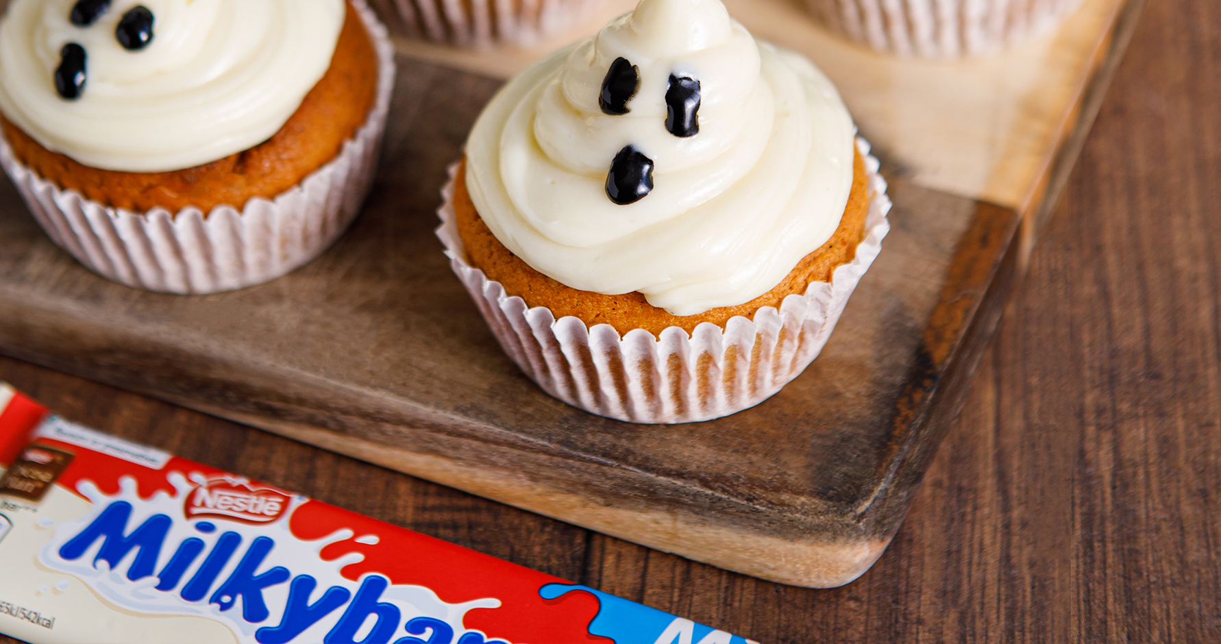 Spooky Pumpkin Cupcakes with Milkybar® Ghost Icing 